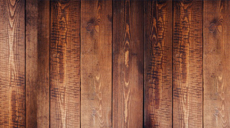 "Topview van een donkere houten vloer met rechte stroken"