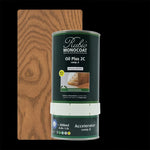 blik Rubio Monocoat Oil Plus 2C beits in kleur antique bronze voor bescherming en kleurbehandeling van houten vloeren en meubels, met achterliggend stuk hout in warm bruin eiken nerfpatroon