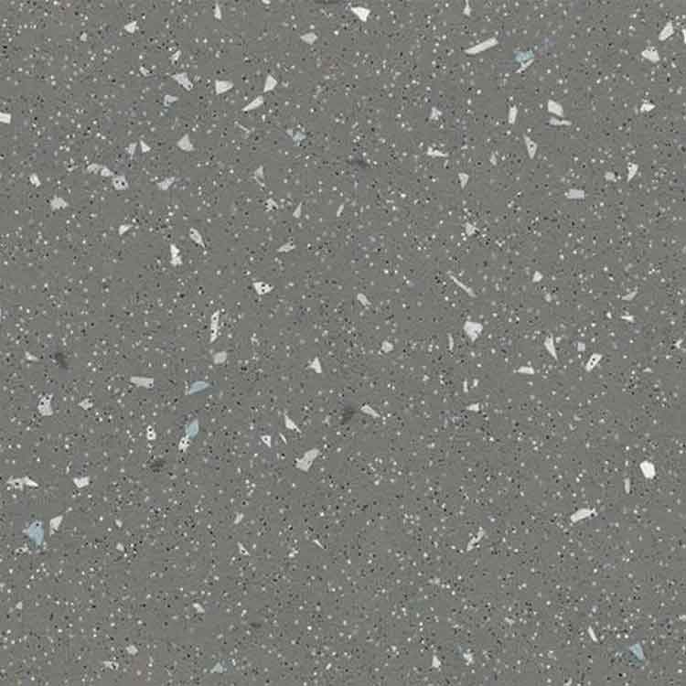 Donker grijze vloer met terrazzo patroon bestaande uit kleine en middelgrote grijswitte en lichtblauwe steentjes.