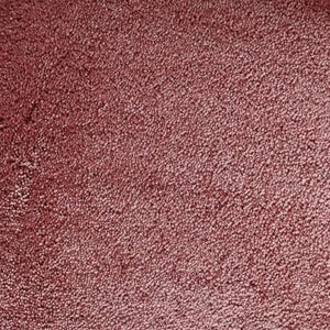 Tapijt met een dichte, zachte pool in een warme roestroze kleur zonder opvallend patroon.