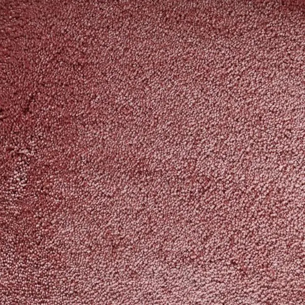 Tapijt met een dichte, zachte pool in een warme roestroze kleur zonder opvallend patroon.